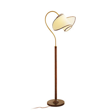 Modern floor lamp with curved gold arm, white lampshade, and dark wooden base