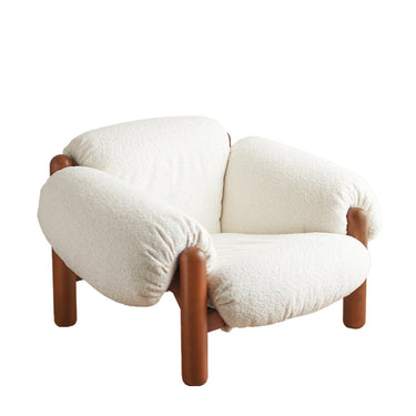 Modern white boucle fabric armchair with rounded cushions and wooden legs, stylish home décor