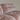 Close-up of a striped patterned sofa against a plain background