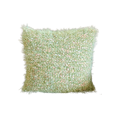 A green square-shaped cushion with a shaggy, textured appearance and a hidden zipper.