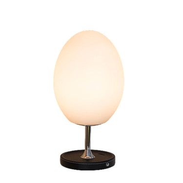 Modern egg-shaped table lamp with white glass shade and black base for stylish home décor