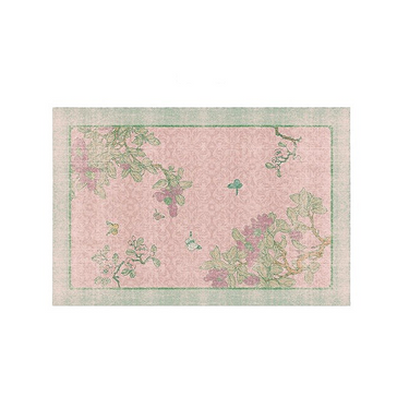 Rectangular floral area rug with pink background, green border, and delicate flower and leaf patterns