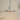 Modern pendant light with metallic finish on a neutral background