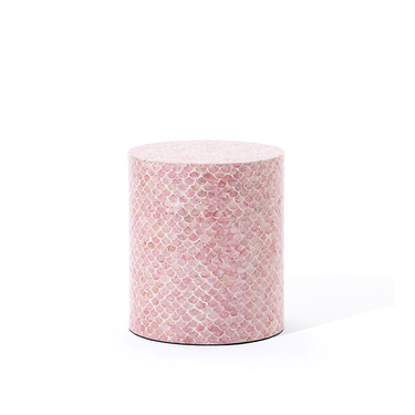 Round pink patterned container on a white background