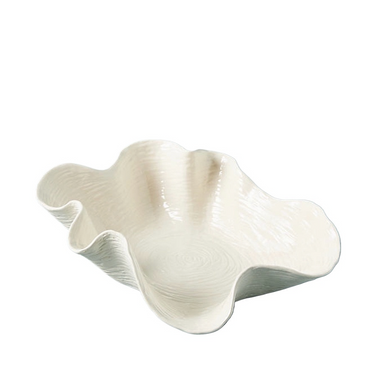 A white, handcrafted ceramic shell plate on a plain background.