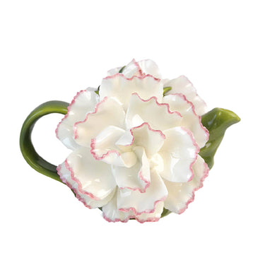 White ceramic teapot shaped like a flower with pink-edged petals and green handle and spout, decorative home décor