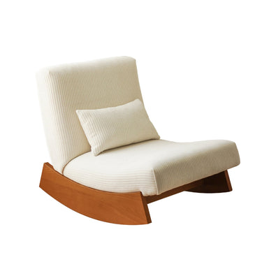 Modern cream upholstered rocking chair with wooden base and matching lumbar pillow