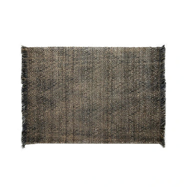 Rectangular woven area rug with geometric tribal pattern and fringed edges, neutral tones, home décor