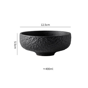 A white ceramic rice bowl with a textured exterior.