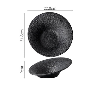 A white ceramic salad plate with a textured surface.