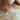 Close-up of a person's feet on a patterned rug