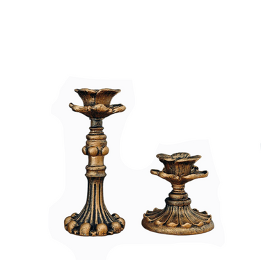 Two brass candle stands of different sizes with a vintage design, isolated on a white background.
