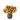 A silk arrangement of artificial sunflowers with green leaves in a brown, ceramic vase.