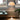 Modern floor lamp in a room with a radiator and window view