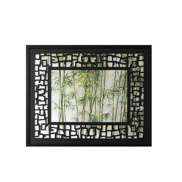 Decorative wall mirror with black geometric frame reflecting green bamboo plants, LaFloria home décor