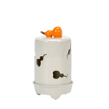 LaFloria white ceramic decorative jar with carved patterns and orange pumpkin lid top