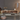 Modern wooden entertainment console in a room with decorative elements.