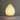 Teardrop-shaped lamp with a warm glow on a gray background