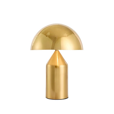 Gold table lamp with a white background
