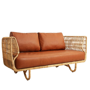 Modern rattan sofa with brown leather cushions, stylish and unique home furniture