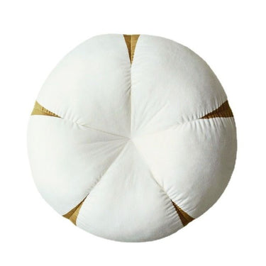 Round white and beige decorative cushion with a soft, plush texture for home décor