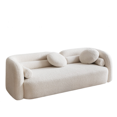 Modern beige boucle fabric sofa with rounded arms and matching round cushions