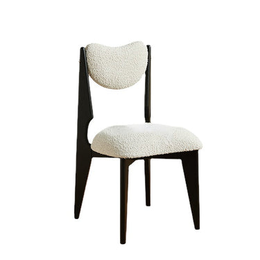 Modern designer chair with black wooden frame and textured white cushioned seat and backrest