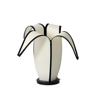 Modern white and black sculptural table lamp with curved panels, designer home décor piece