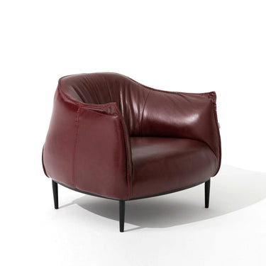 Modern burgundy leather armchair with black metal legs on white background