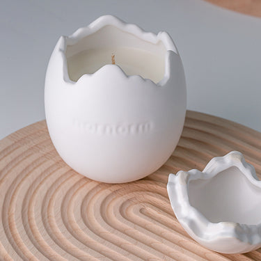 handmade scented candle in white eggshell container