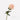 A bunch of artificial silk roses in various shades of pink and white, with green leaves.