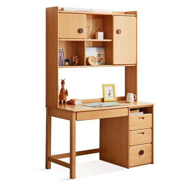 A beech wood study table with a mirrored shelf above it, a drawer at the front, and a small wooden chair. The table is standing on a solid wooden base.