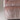 Close-up of a textured fabric chair with a neutral color palette.