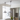 Modern kitchen interior with pendant lights and a vase of flowers.