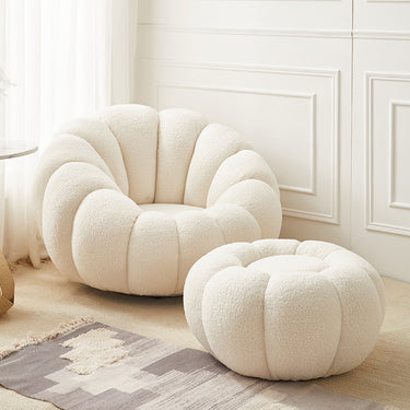 rotating armchair with cream bouclé upholstery
